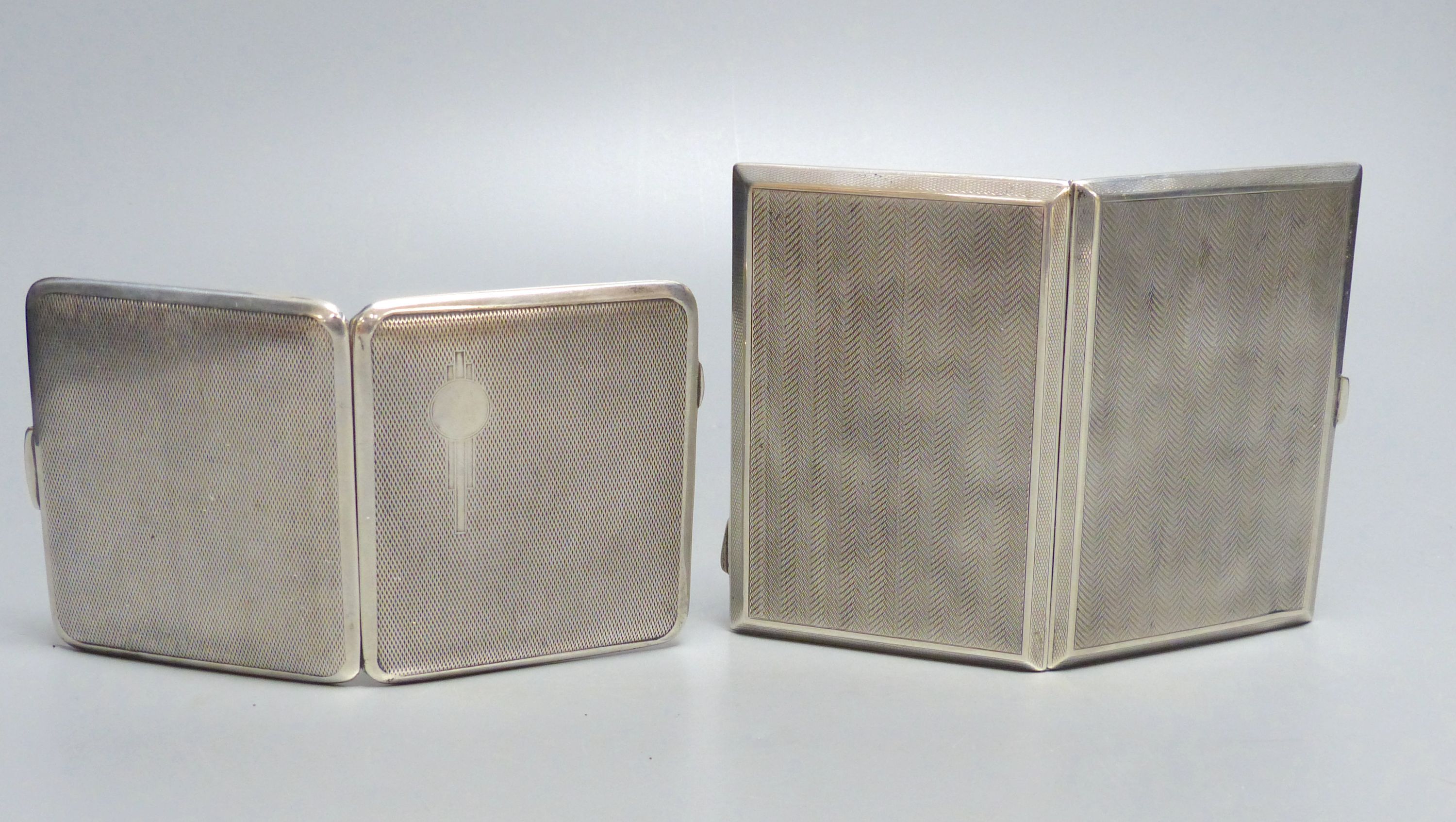 An early 20th century engine turned silver cigarette case, S. Blanckensee & Co Ltd, Chester, ??, 12.1cm & a plated case.